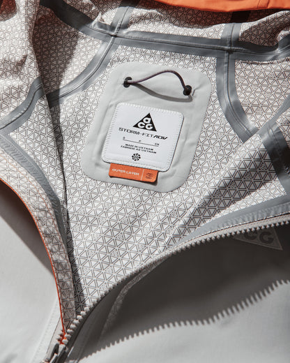 Nike W Acg Sfadv Phantazma Jkt Safety Orange/Grey Fog/Summit  Coats and Jackets Jackets IF0101-819